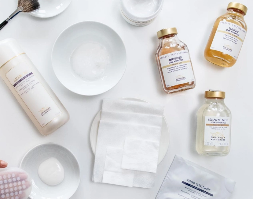 Several beauty products on a white table